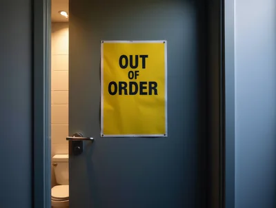 Out Of Order Sign On A Restroom Door