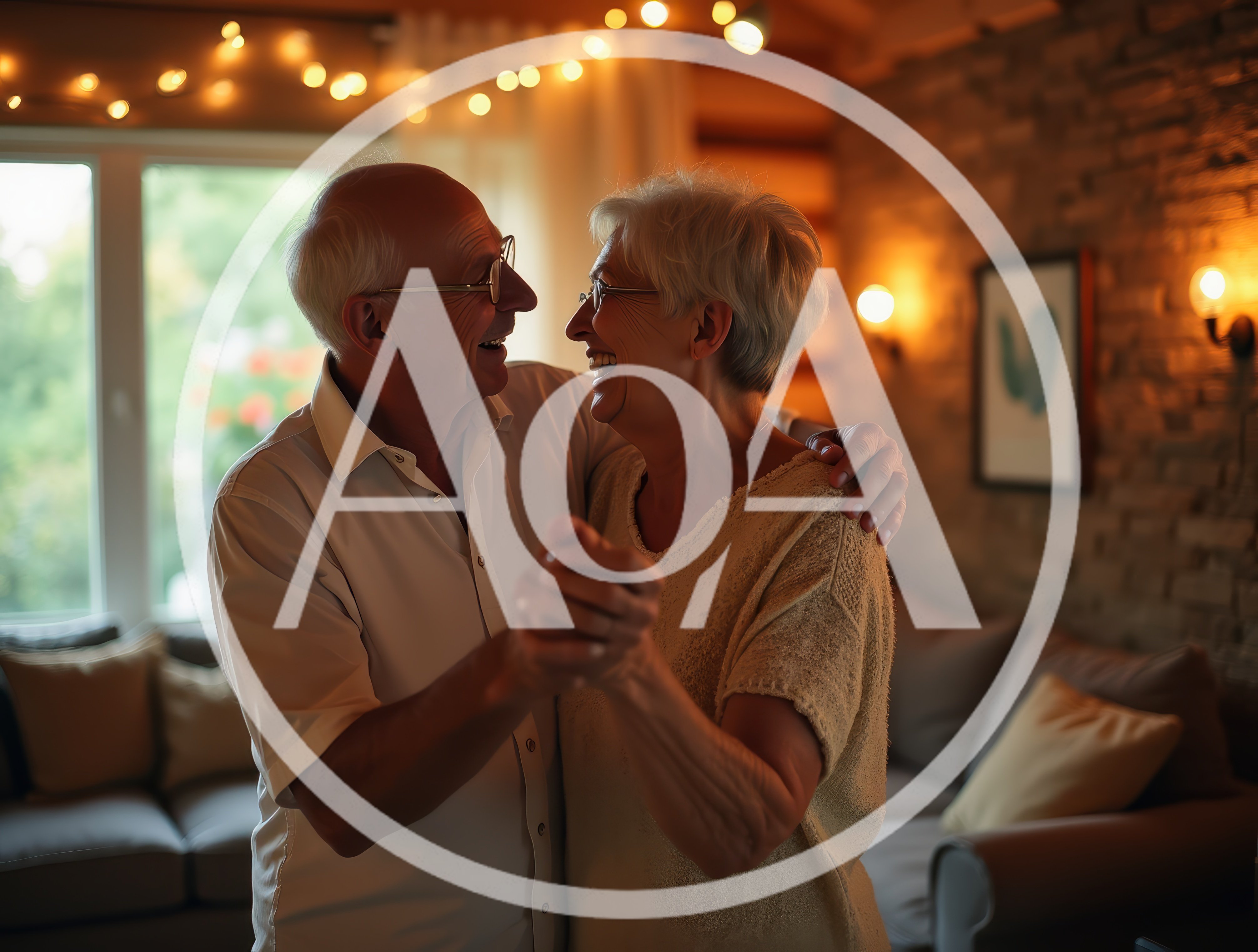 Happy Senior Couple Dancing Together In Living Room