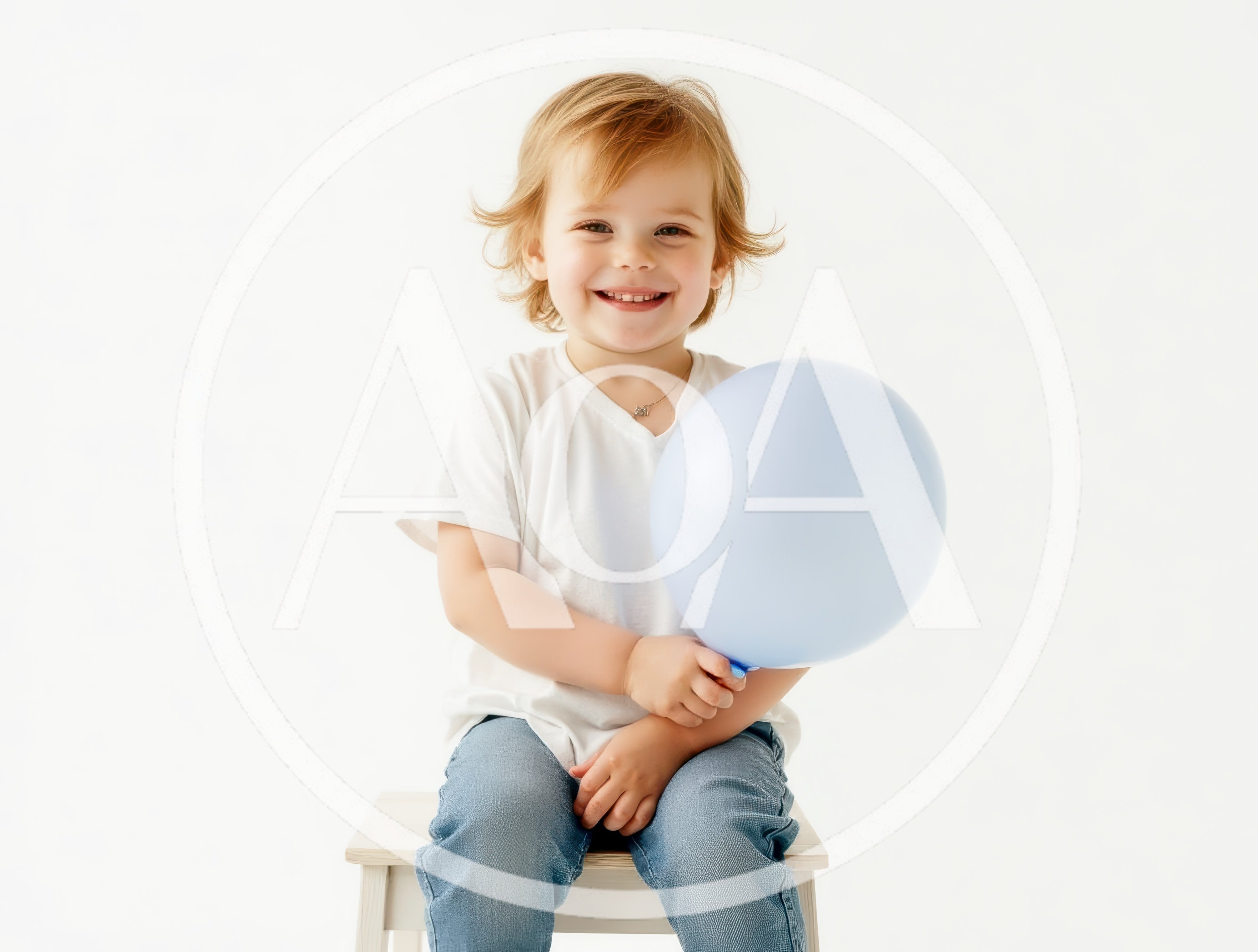 Happy Toddler Holding A Light Blue Balloon