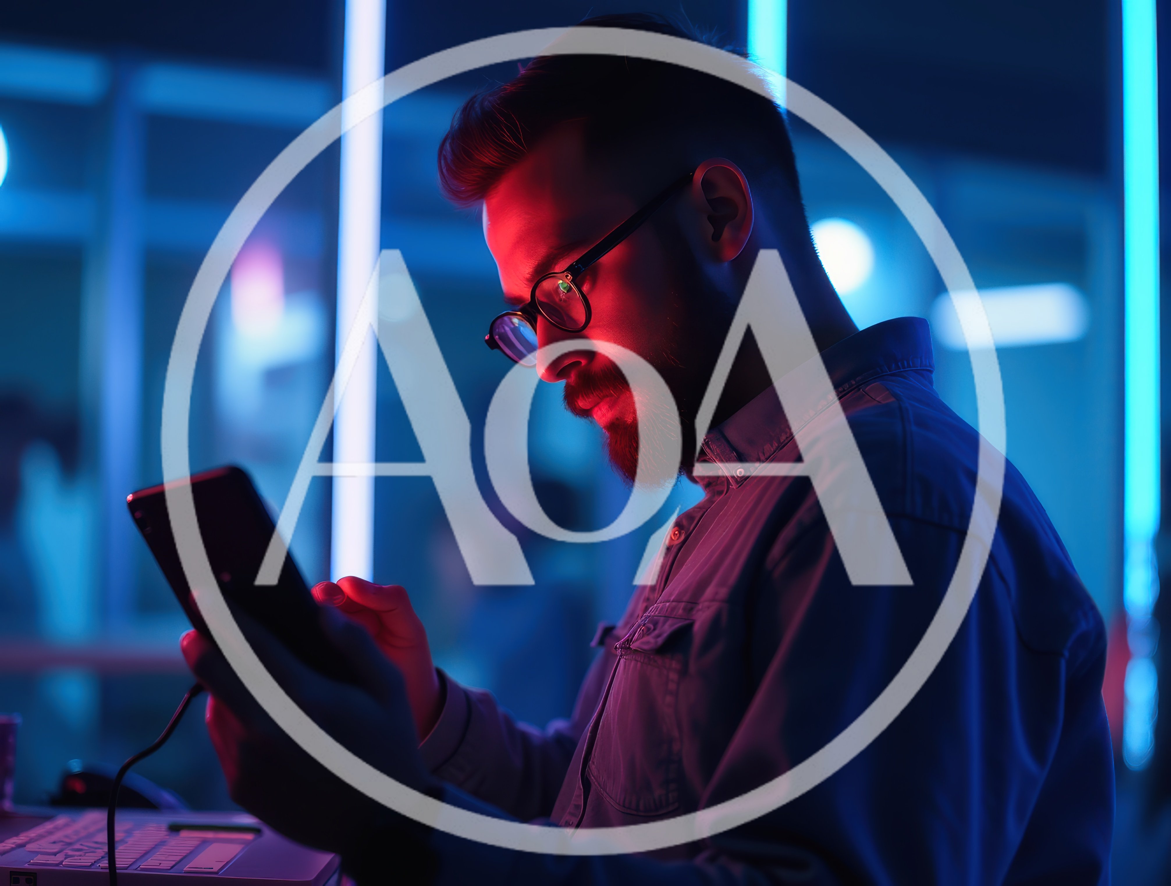 Young Man Using Smartphone In Neon Lit Office