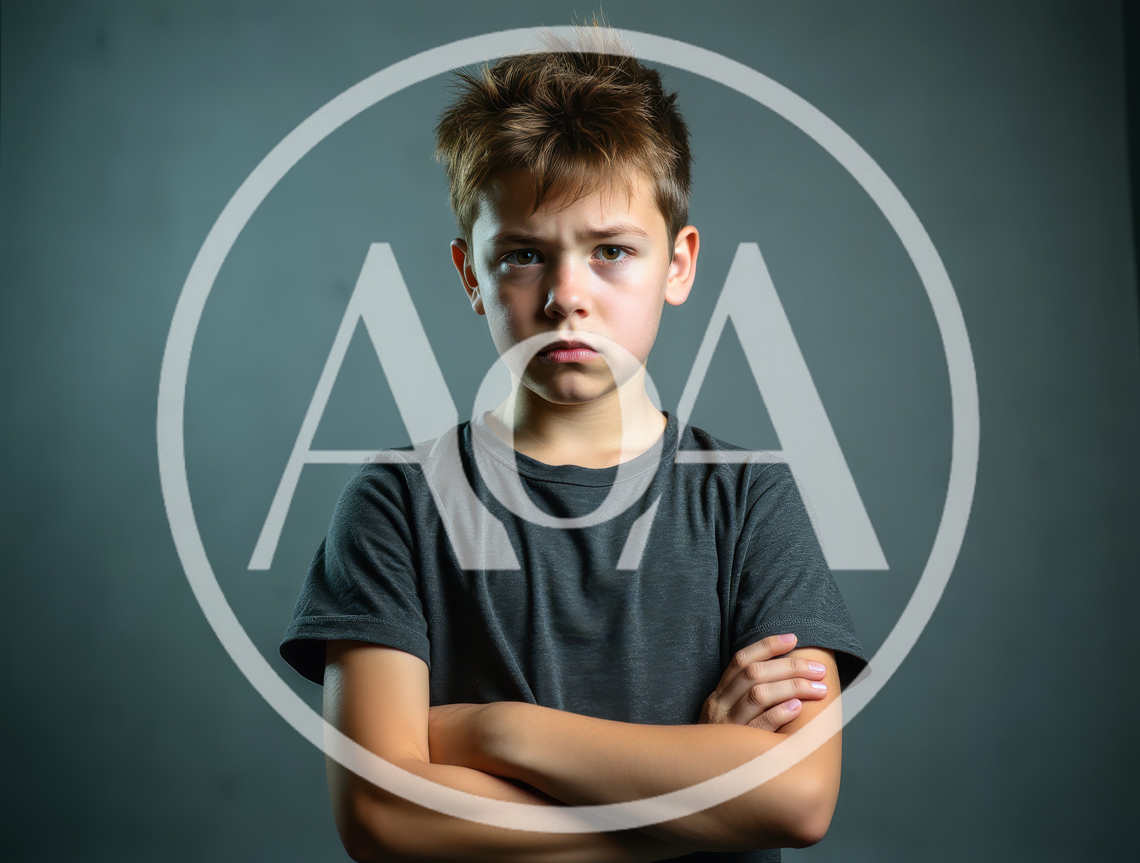 Portrait Of A Serious Young Boy With Crossed Arms