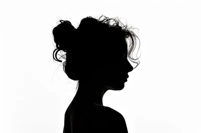 Silhouette Of A Woman With Messy Bun Hairstyle