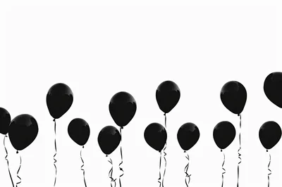 Floating Black Balloons Against A White Background