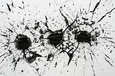 Two Bullet Holes In Shattered White Glass