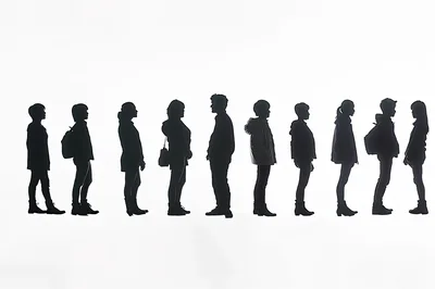Silhouettes Of People Standing In A Line