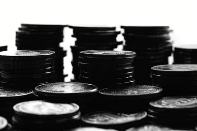 Stacks Of Metallic Coins In Monochrome