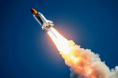 Space Shuttle Launching Into Clear Blue Sky