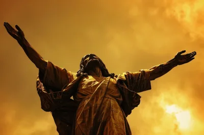 Golden Statue Of Jesus Christ With Arms Outstretched