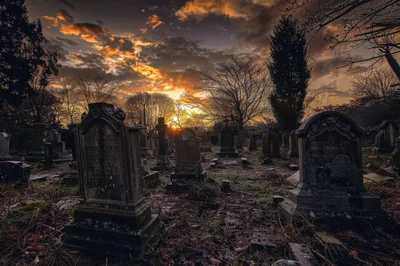 Old Cemetery At Sunset With Dramatic Golden Sky