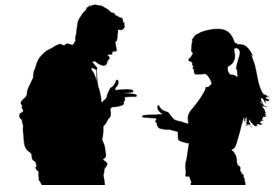 Silhouettes of Man and Woman Arguing and Pointing