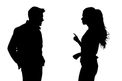 Silhouettes Of A Man And Woman Arguing
