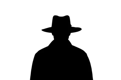Silhouette Of A Man Wearing A Fedora Hat