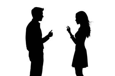 Silhouettes of a Man and Woman Communicating
