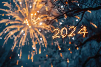 Sparkler Writing 2024 Against Fireworks Background