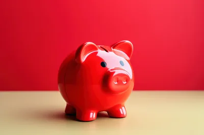 Red Piggy Bank On A Two Tone Background