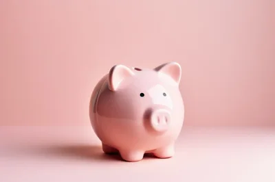 Pink Piggy Bank On A Solid Pink Background