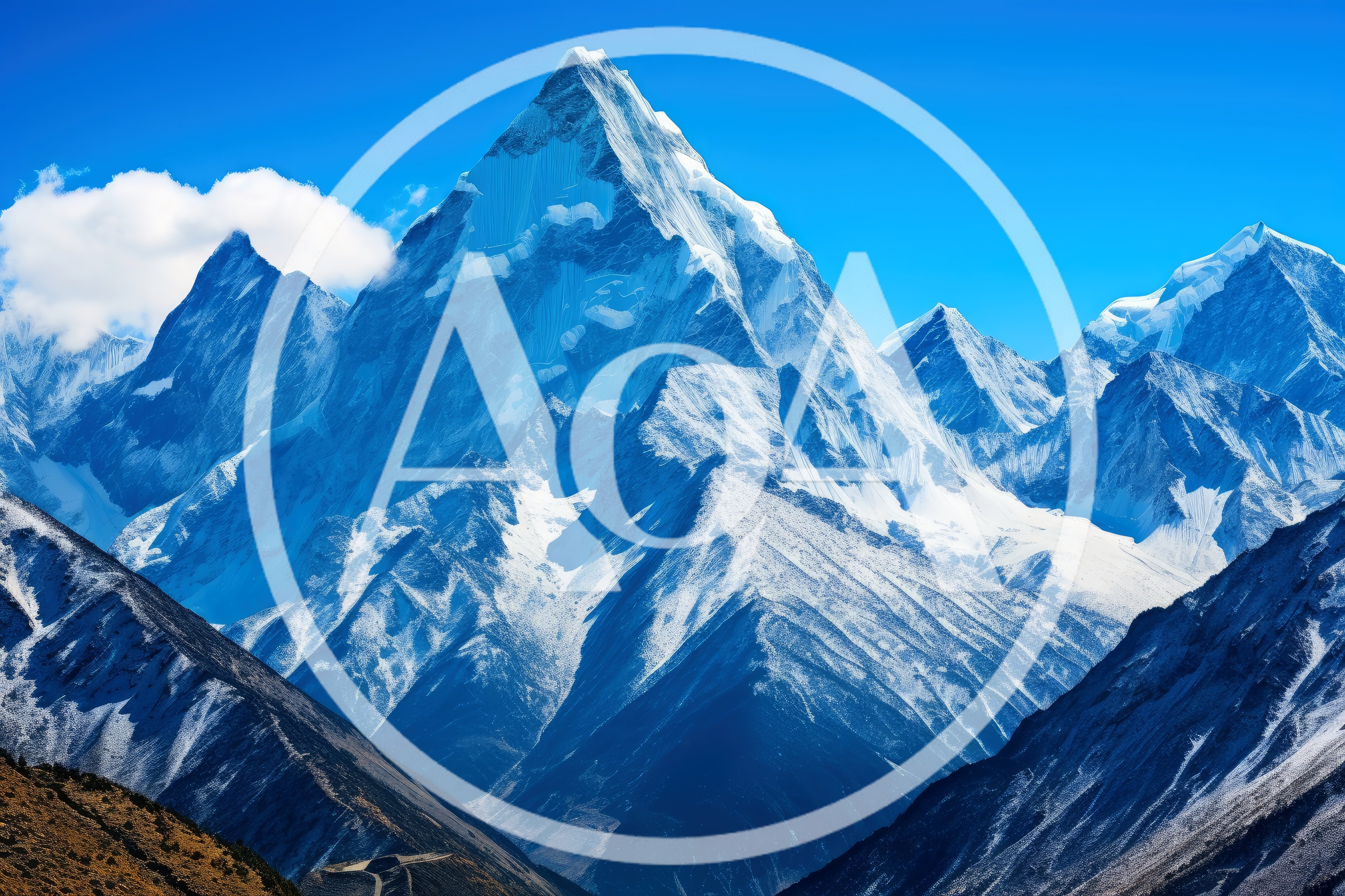 Majestic Snow Capped Mountain Peaks Under Clear Blue Sky