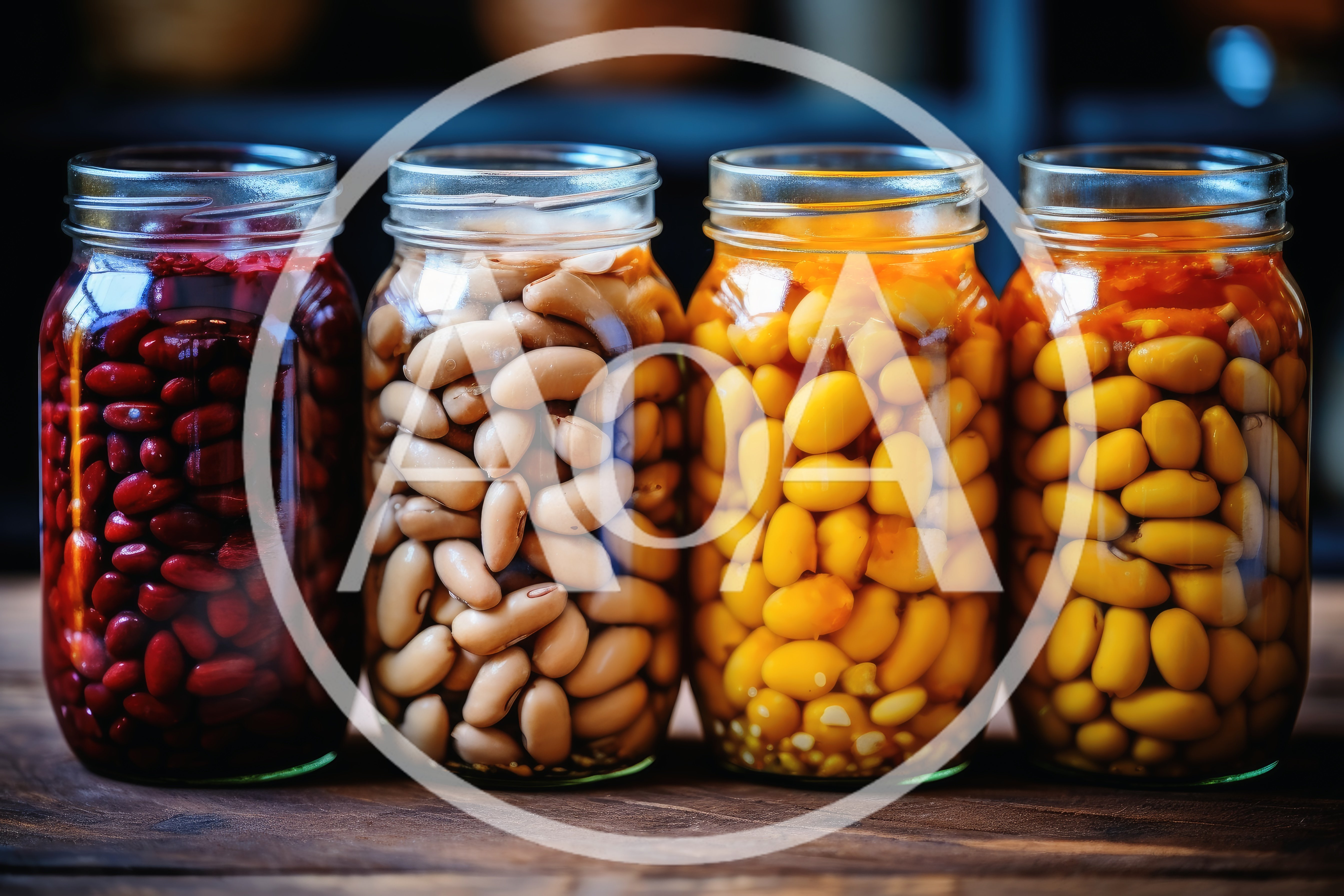 Four Glass Jars Filled With Assorted Preserved Beans