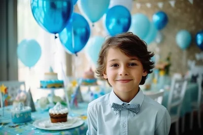 Young Boy Celebrating Birthday Party With Blue Balloons