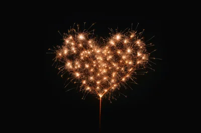 Sparkler Heart Shape Against Black Background
