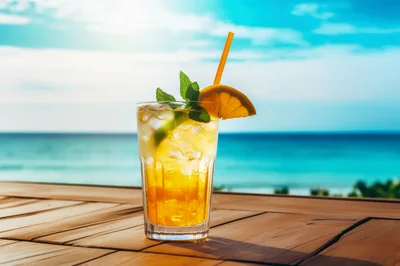 Refreshing Tropical Cocktail On A Sunny Beach Table