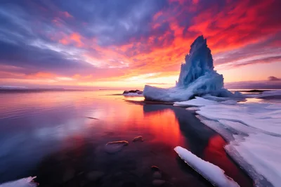 Stunning Iceberg Formation Under A Vibrant Sunset Sky