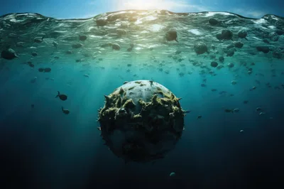 Submerged Spherical Object Floating In Deep Ocean Waters