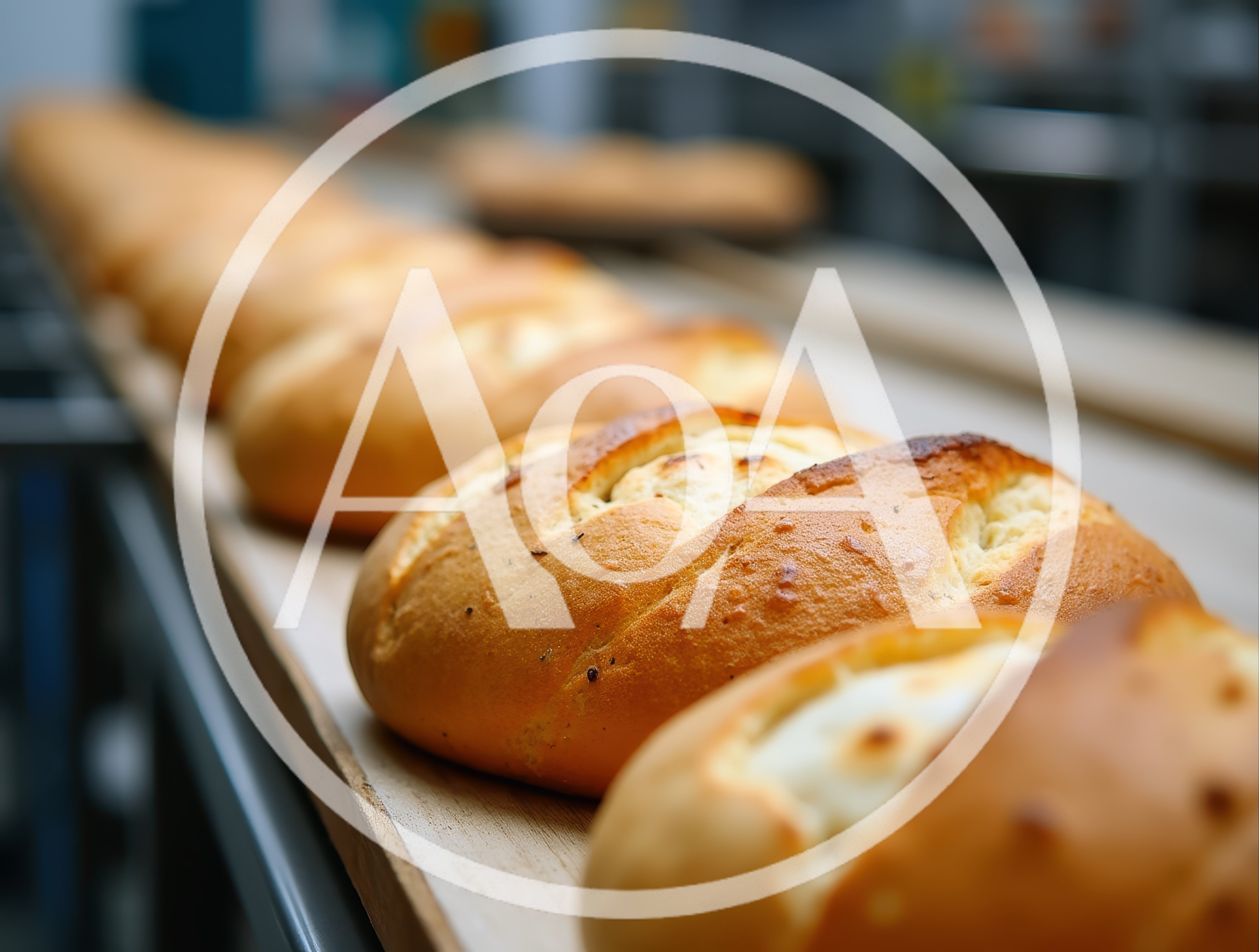 Freshly Baked Loaves Of Bread On A Bakery Conveyor