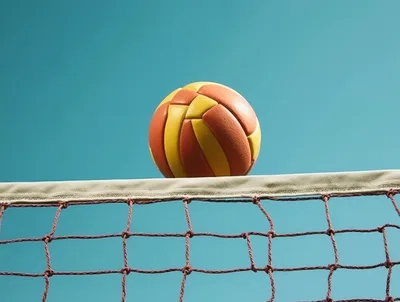 Volleyball Resting On Top Of A Net