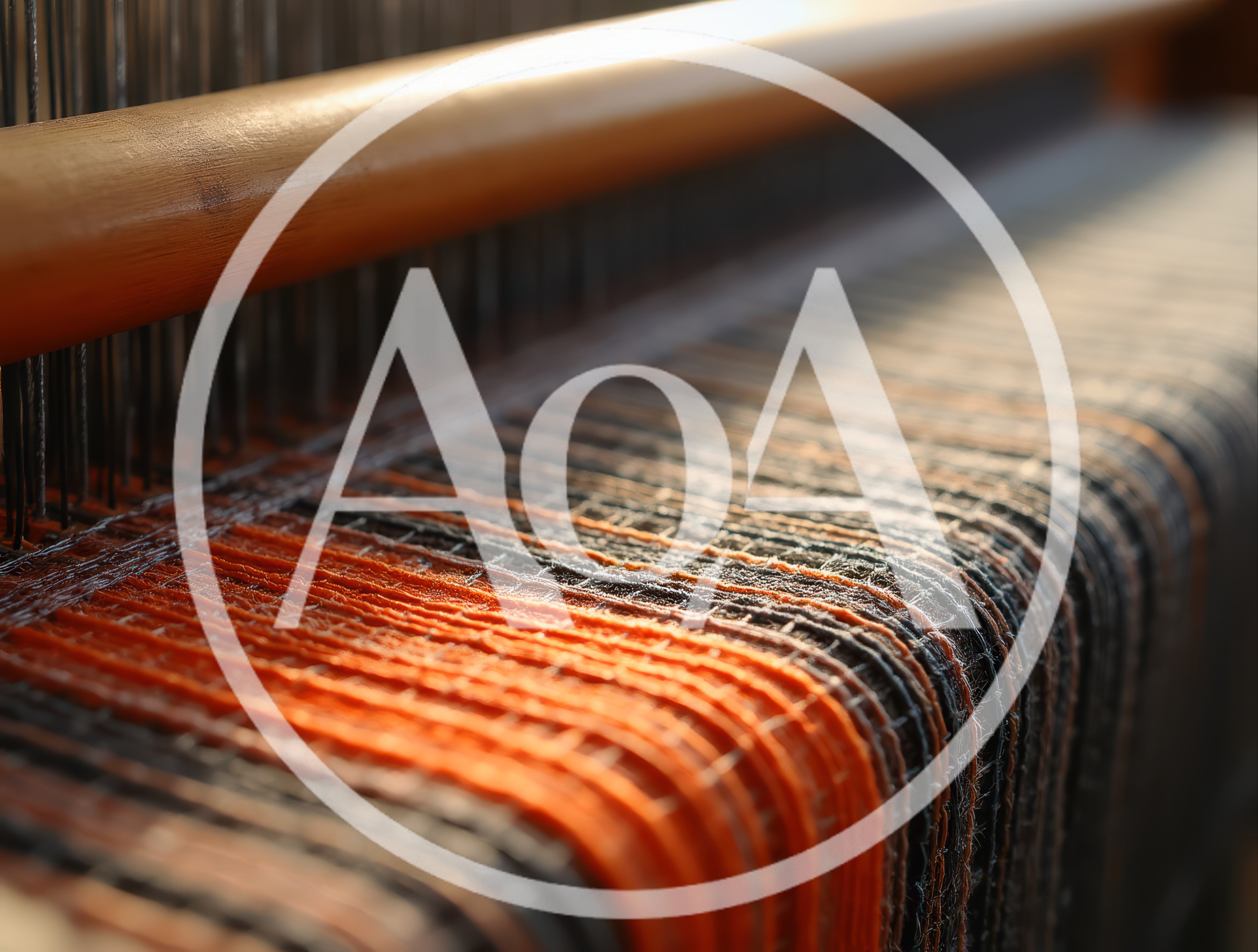 Close Up Of Orange And Black Threads On Loom