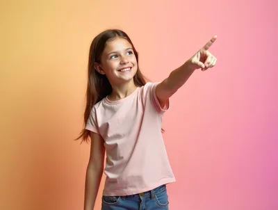 Happy Young Girl Pointing Upwards Against Gradient Background