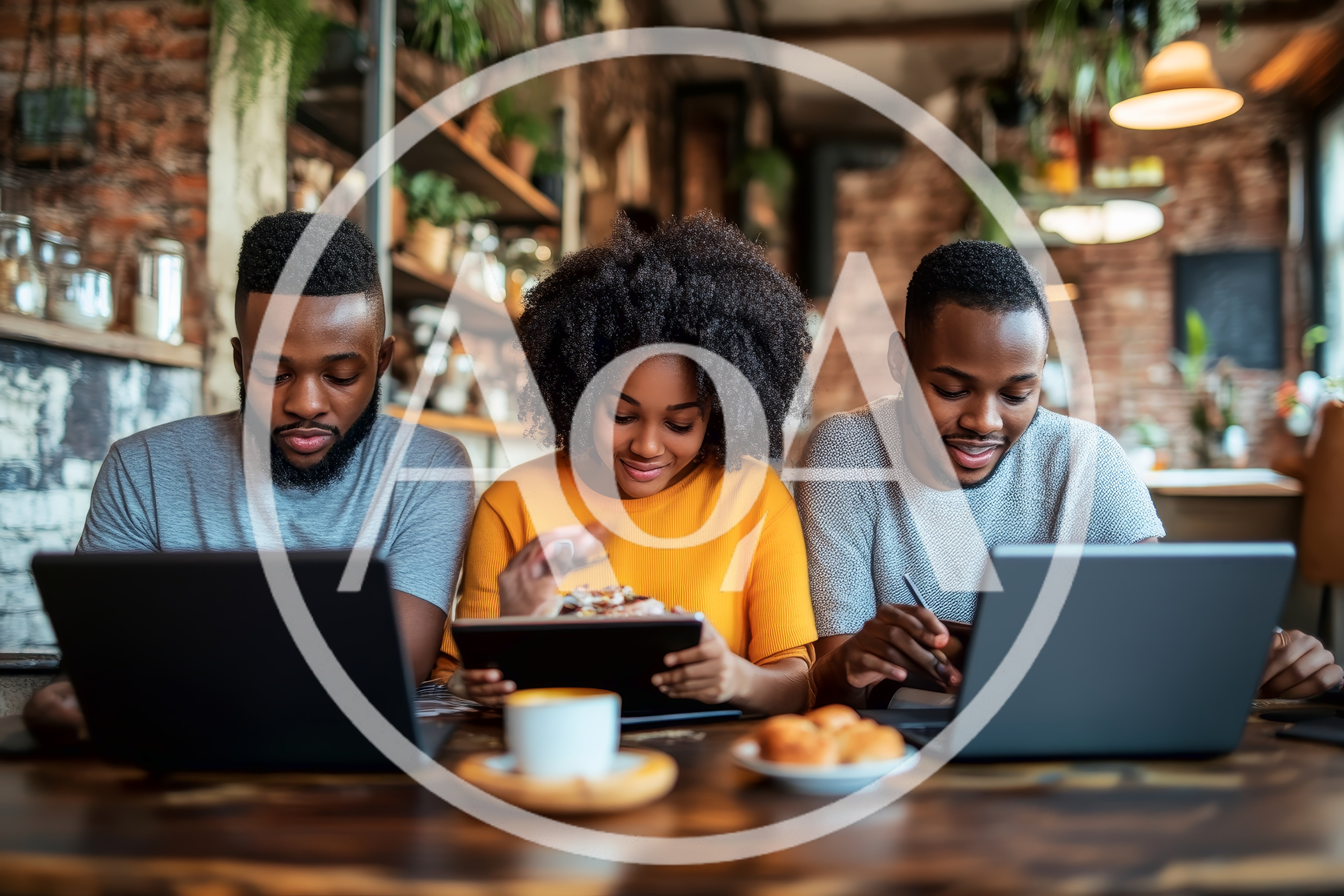 Three Young Professionals Working Together in a Cafe