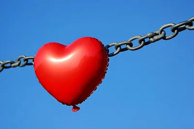 Red Heart Balloon Attached To A Metal Chain