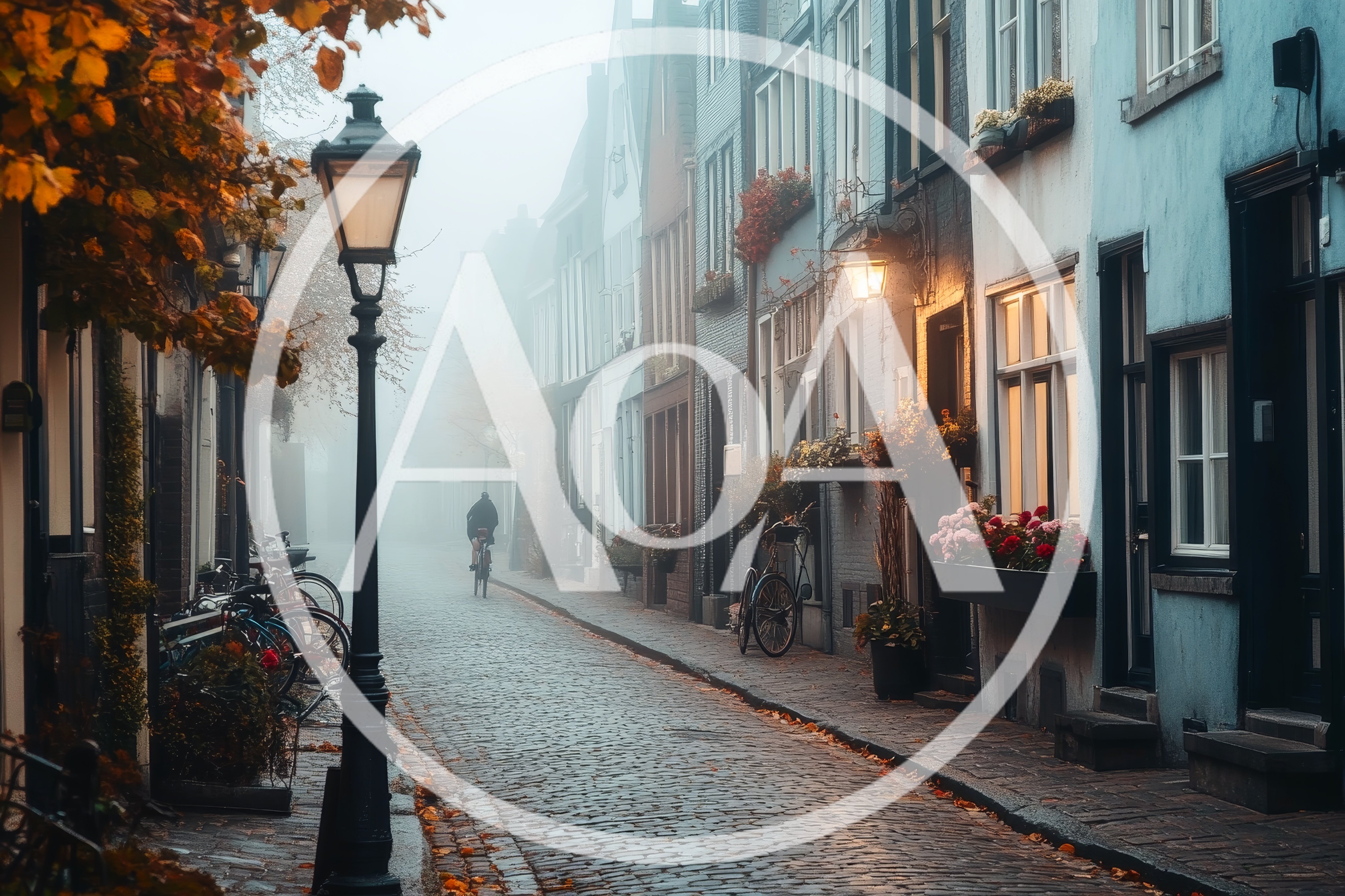 Cyclist Riding Down A Misty Cobblestone Street