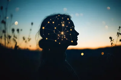 Silhouette Of A Woman With A Glowing Neural Network