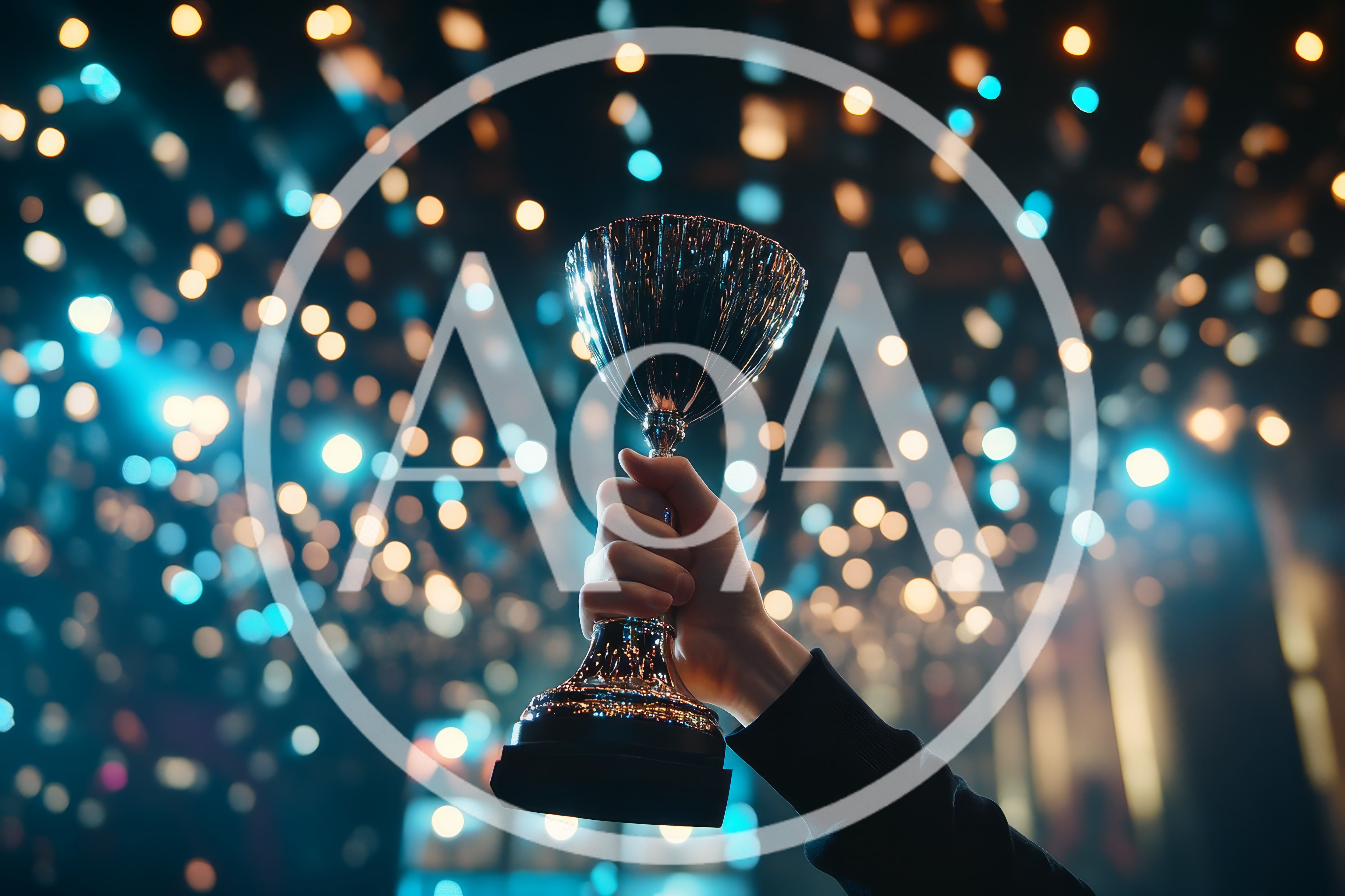 Hand Holding A Shiny Silver Trophy Cup