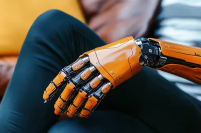 Close Up Of A Futuristic Orange Robotic Hand