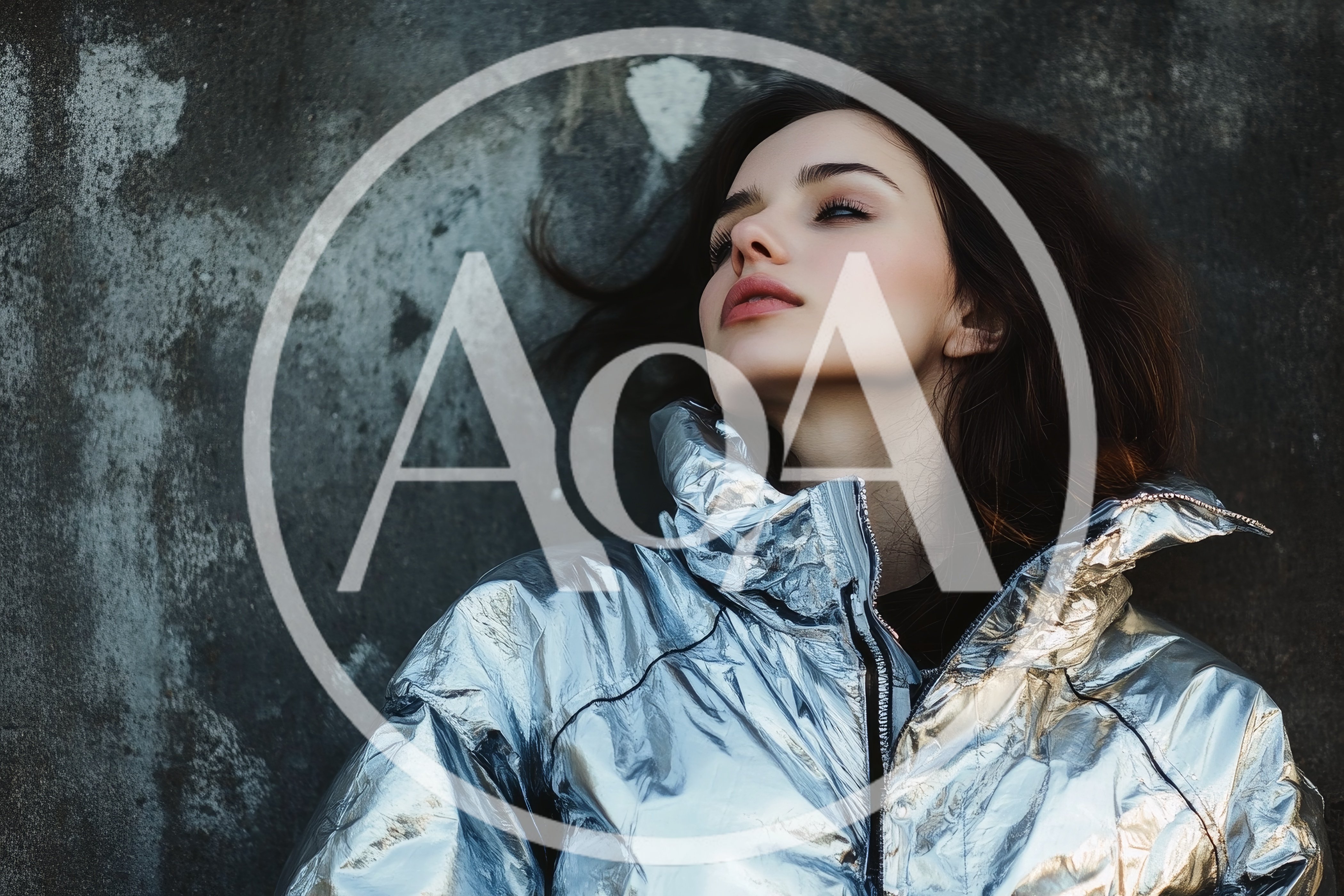 Young Woman Posing In A Metallic Silver Puffer Jacket