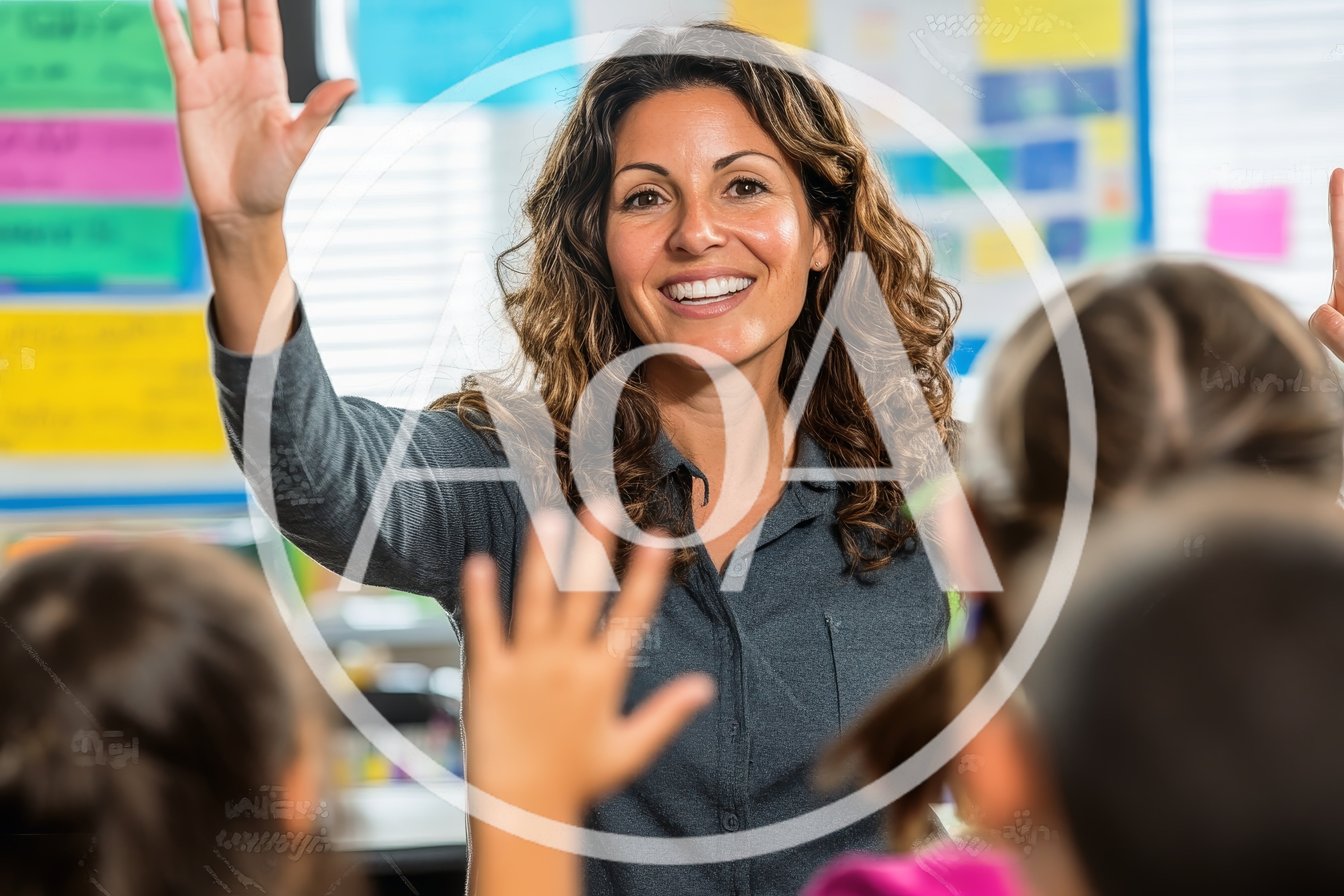 Teacher High Fiving Students In Classroom