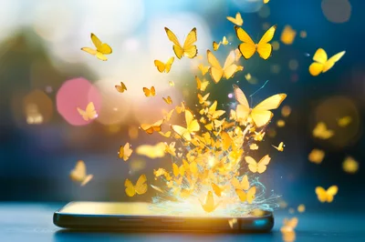 Yellow Butterflies Emerging From A Smartphone Screen