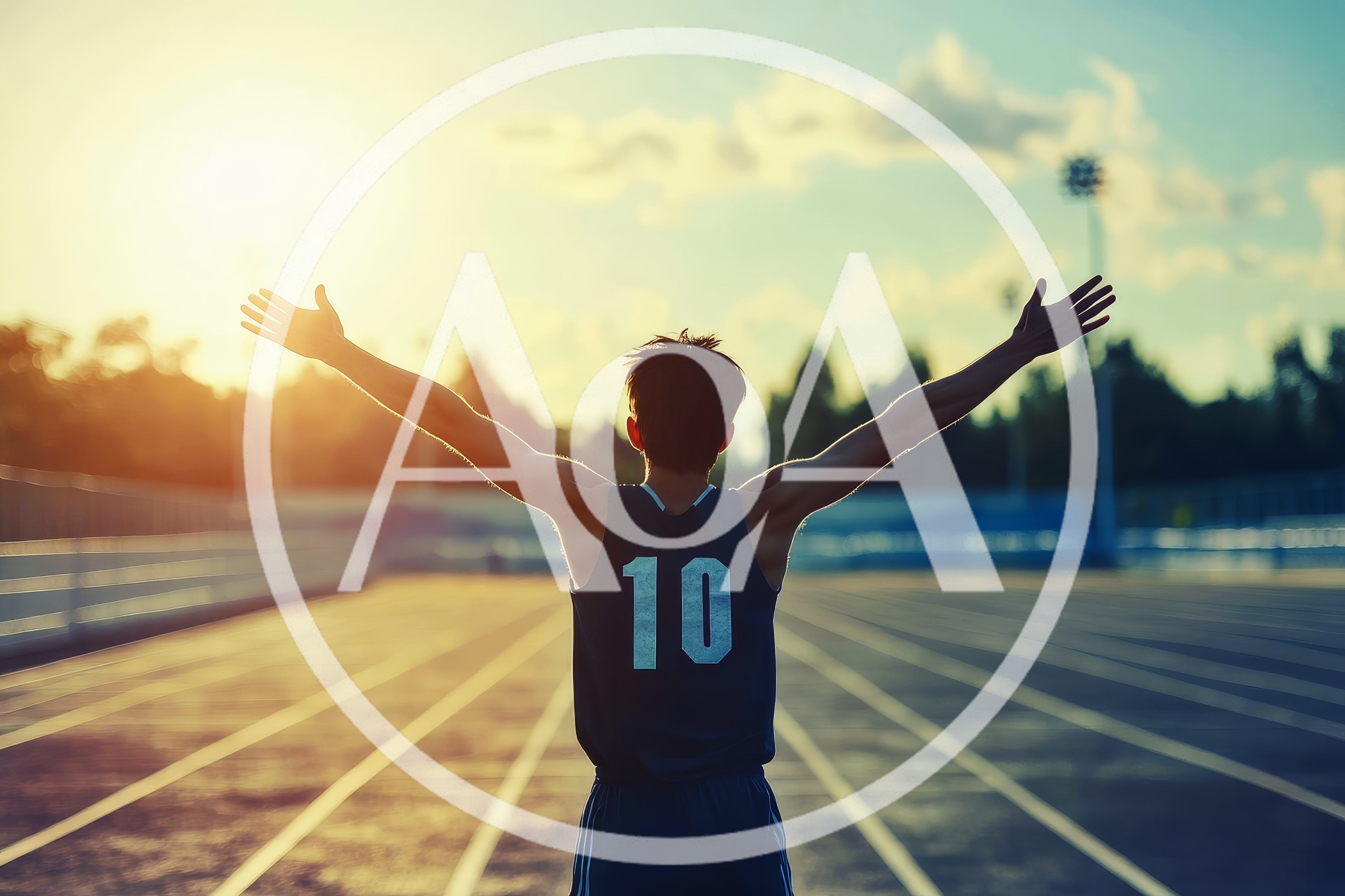 Athlete Celebrating Victory on Running Track at Sunset