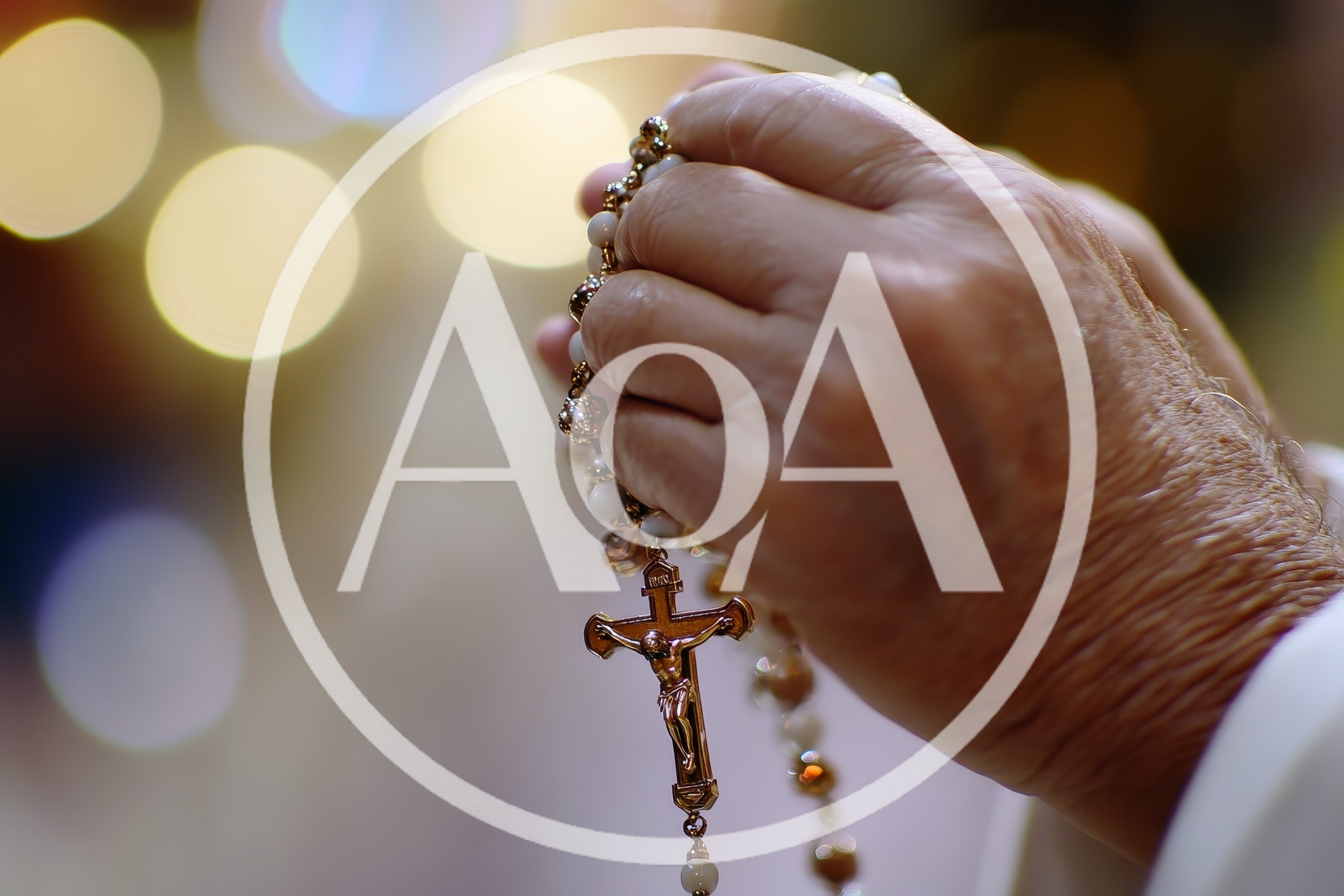 Elderly Hands Holding A Rosary In Prayer