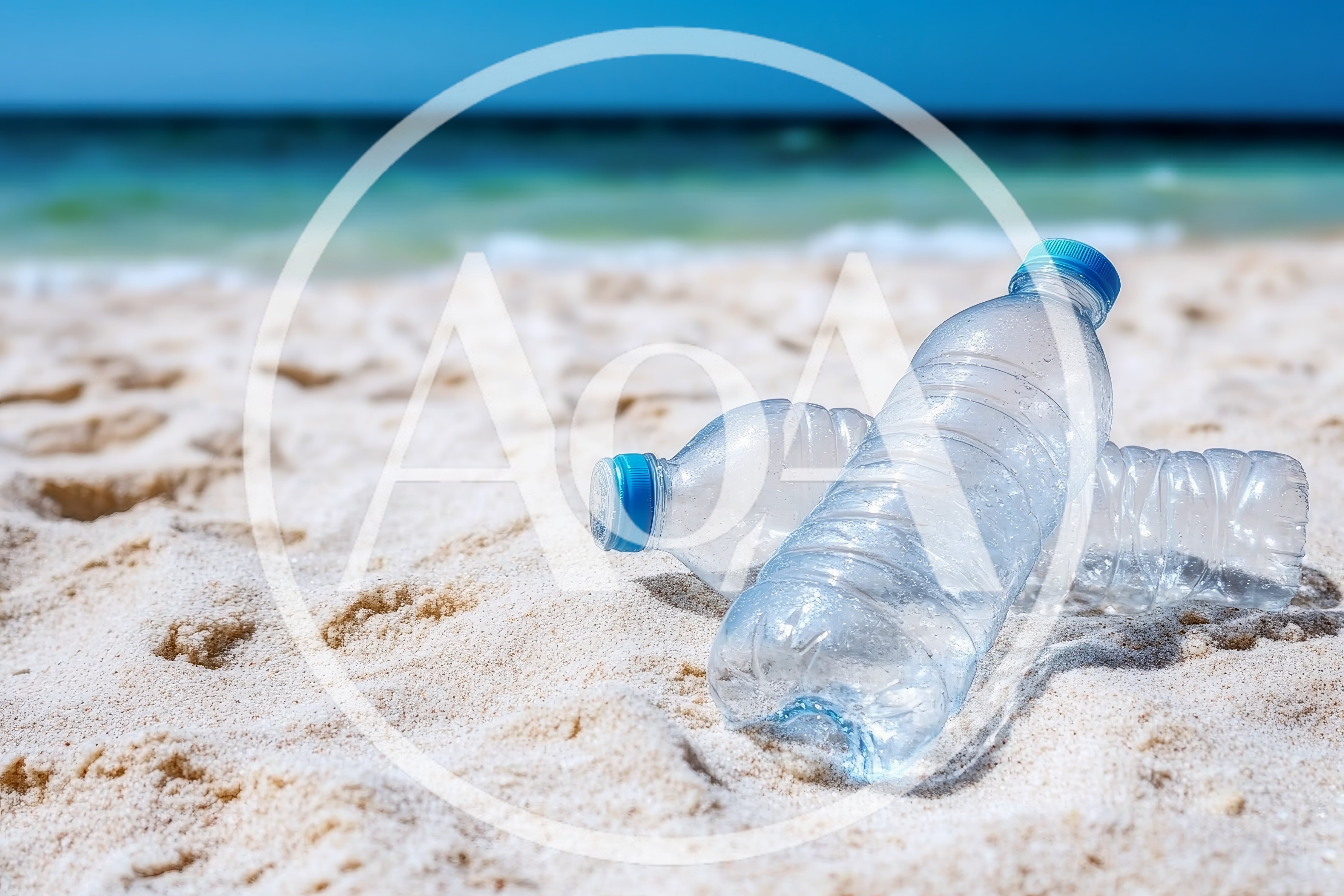Two Empty Plastic Water Bottles On Sandy Beach