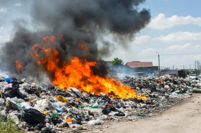 Large Garbage Fire Burning At An Illegal Landfill