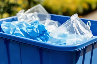 Blue Plastic Bin Filled With Medical Waste