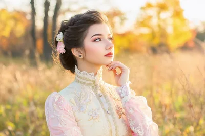 Young Woman in Victorian Style Dress in Autumn Field