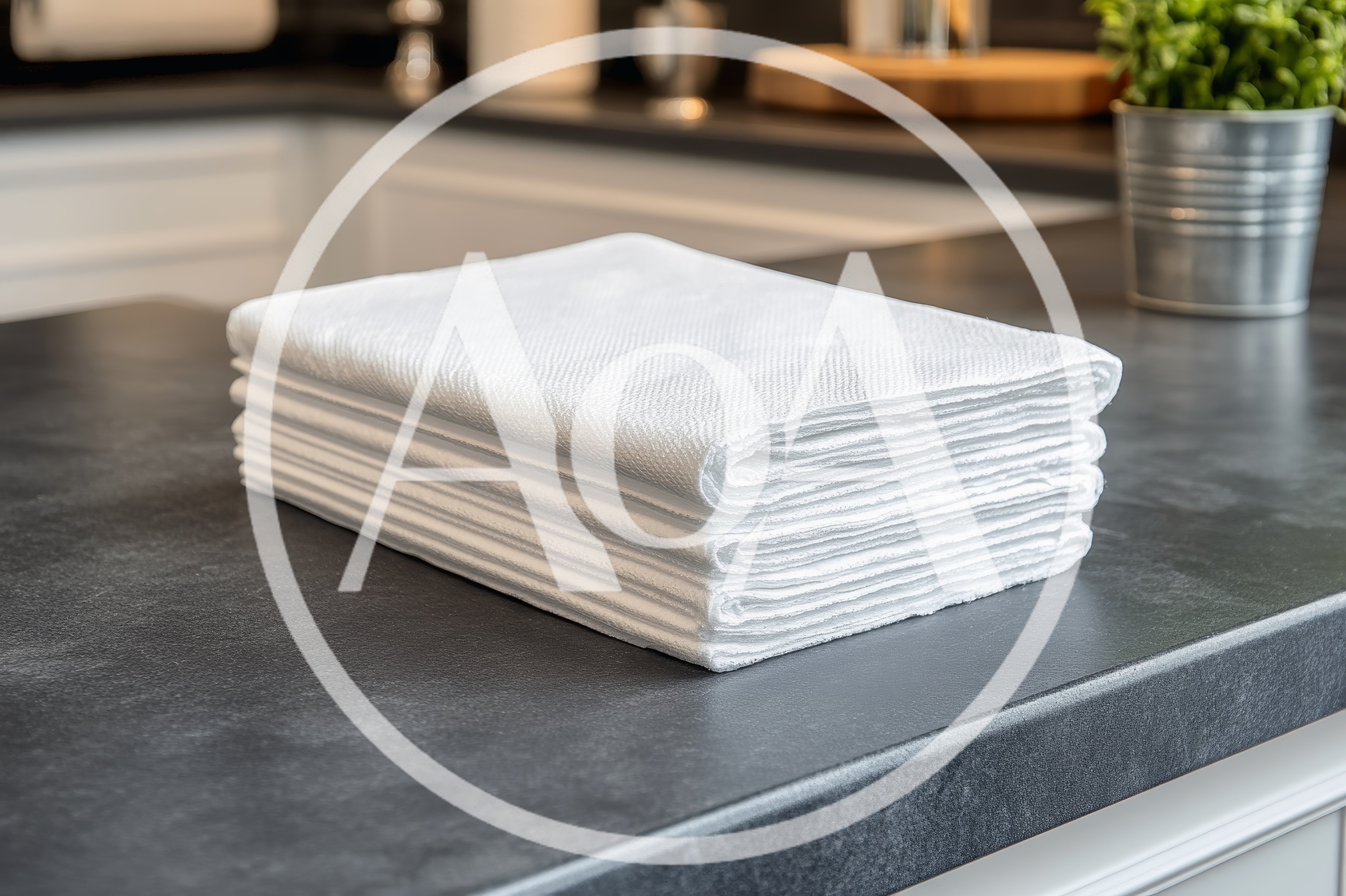 Stack Of Clean White Kitchen Towels On Countertop