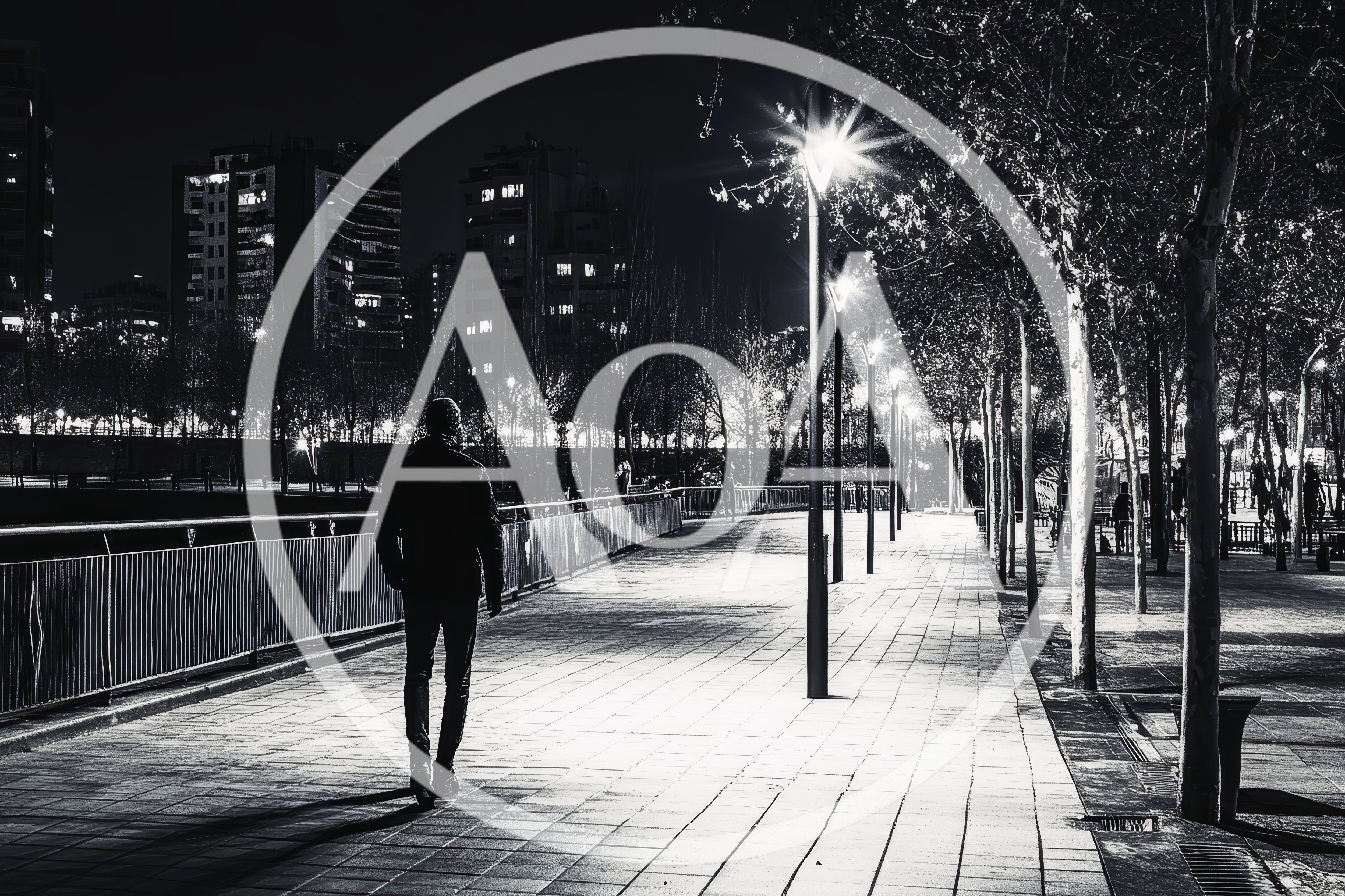 Man Walking Alone on a City Promenade at Night