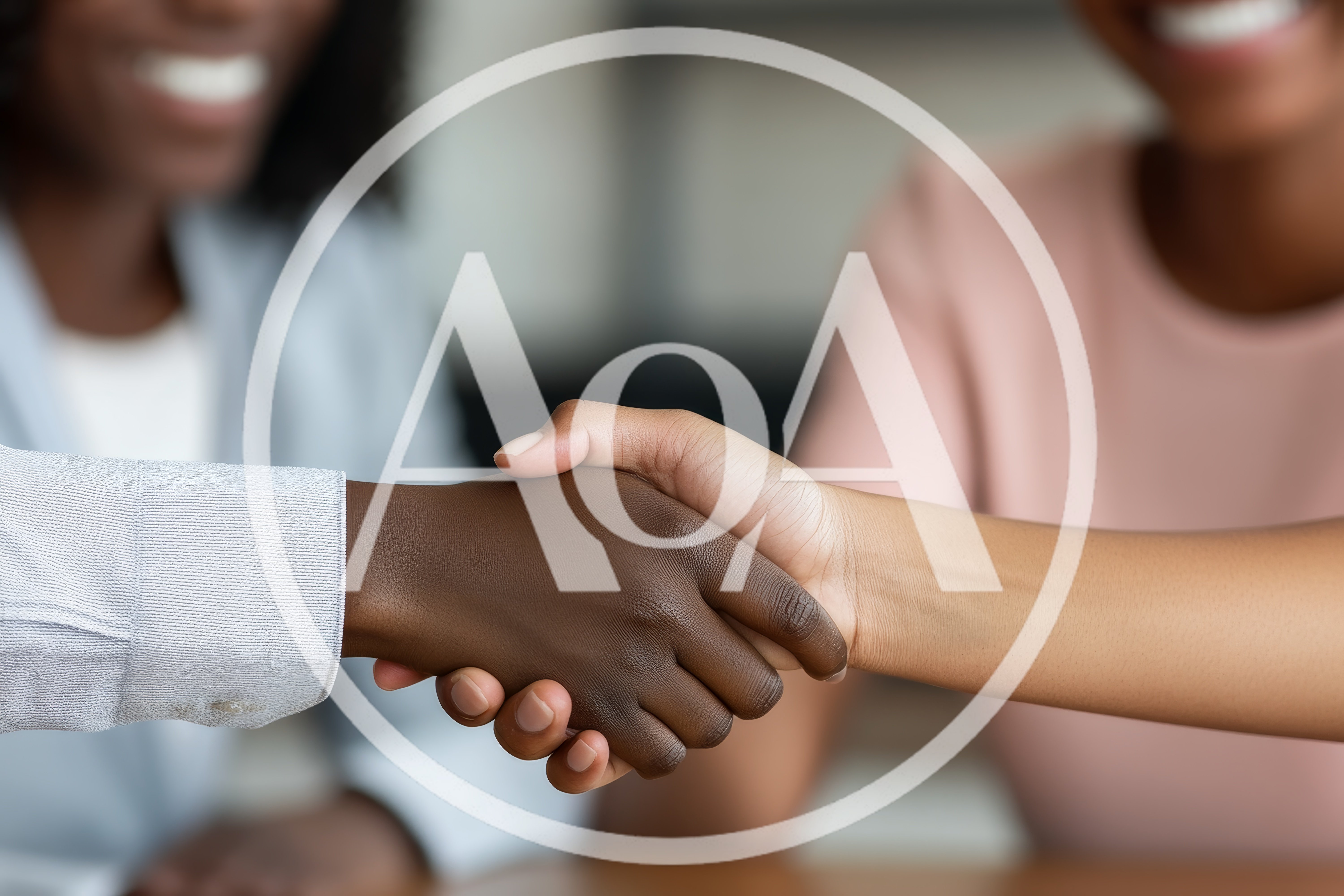 Close Up Of Two Women Shaking Hands