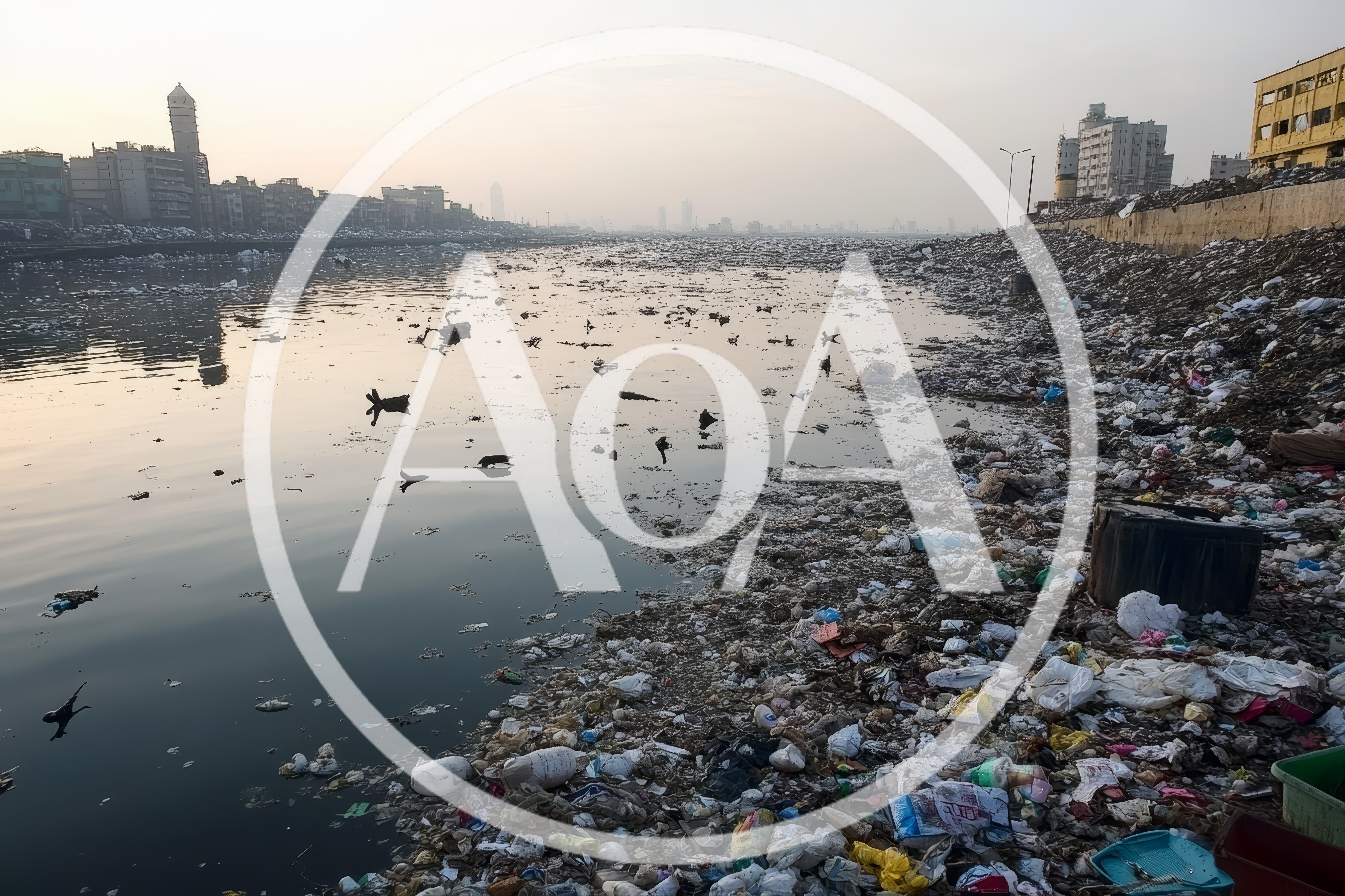 Polluted Riverbank With Massive Accumulation Of Plastic Waste